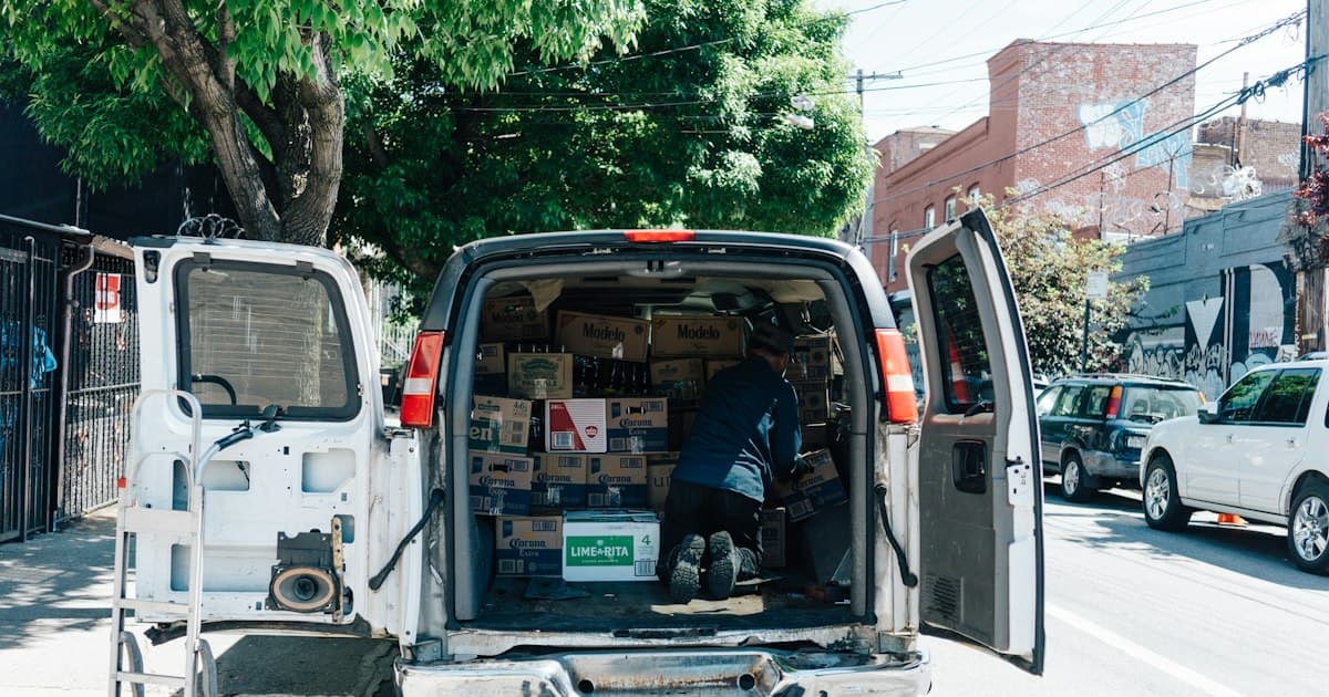 The open back doors of a white service van